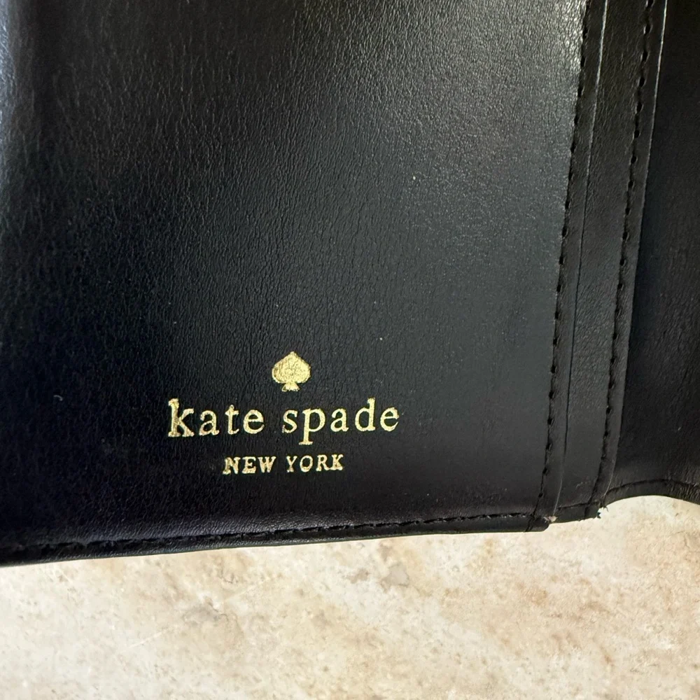 KATE SPADE ladies wallet 3 1/2 x 7” preowned good fair condition, purple black